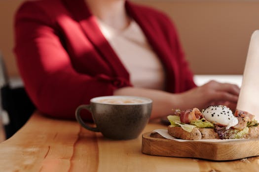 Enjoy a relaxing brunch with avocado toast and coffee in a cozy cafe setting. Perfect for food lovers.