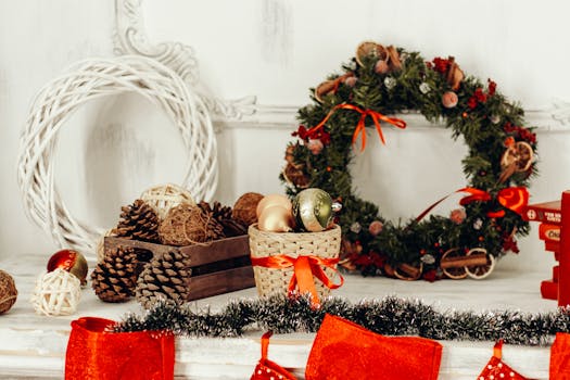 Charming Christmas display featuring a wreath, ornaments, and pine cones for holiday decor.