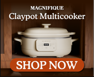 clay pot oven sitting in an open brown wood cabinet