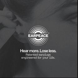 woman putting earpeace ear plug in her ear