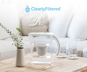 clearly filtered water pitcher sitting on a table in a living room 