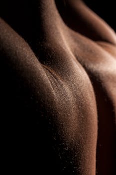 A captivating close-up image showcasing skin texture with elegant lighting, creating a dramatic effect.