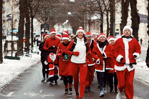 Group of people dressed as Santa Claus running in snowy Gothenburg streets, Sweden.