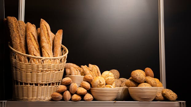 A variety of delicious breads displayed in a basket and bowls, perfect for bakery themes.