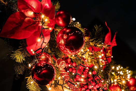 Vibrant Christmas garland with lights and baubles in Paris, capturing holiday spirit.