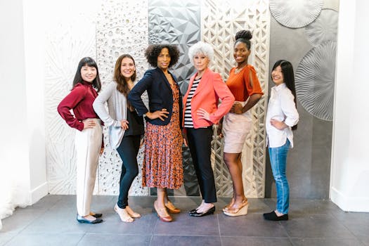 Group of confident women leaders posing in a stylish, modern office environment, showcasing empowerment and diversity.
