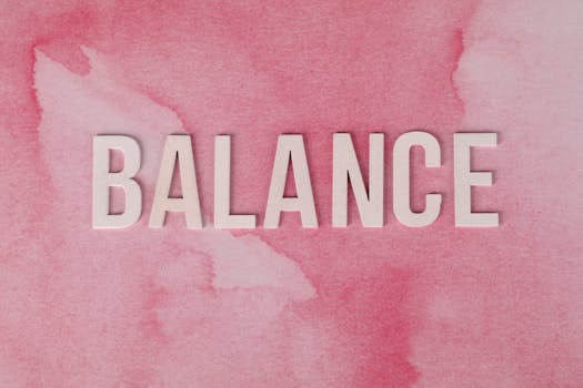 The word 'BALANCE' displayed in bold letters on a pink abstract background.