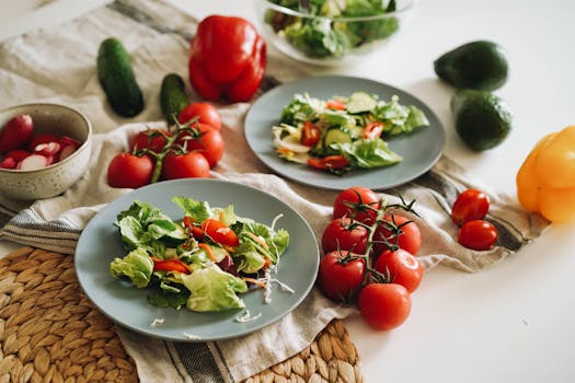 A vibrant plate of fresh salad featuring cherry tomatoes, avocado, and colorful veggies.