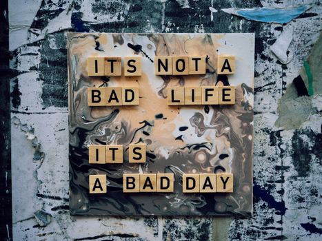 Inspirational quote on artistic marble background with positive message.